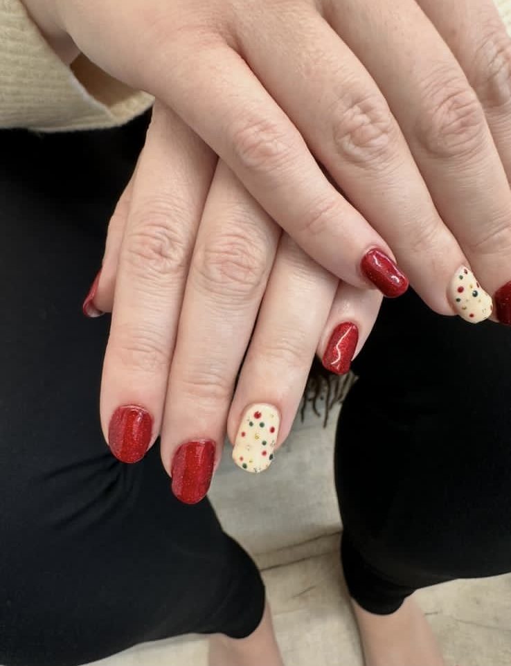 Red gel nails with dot nail art