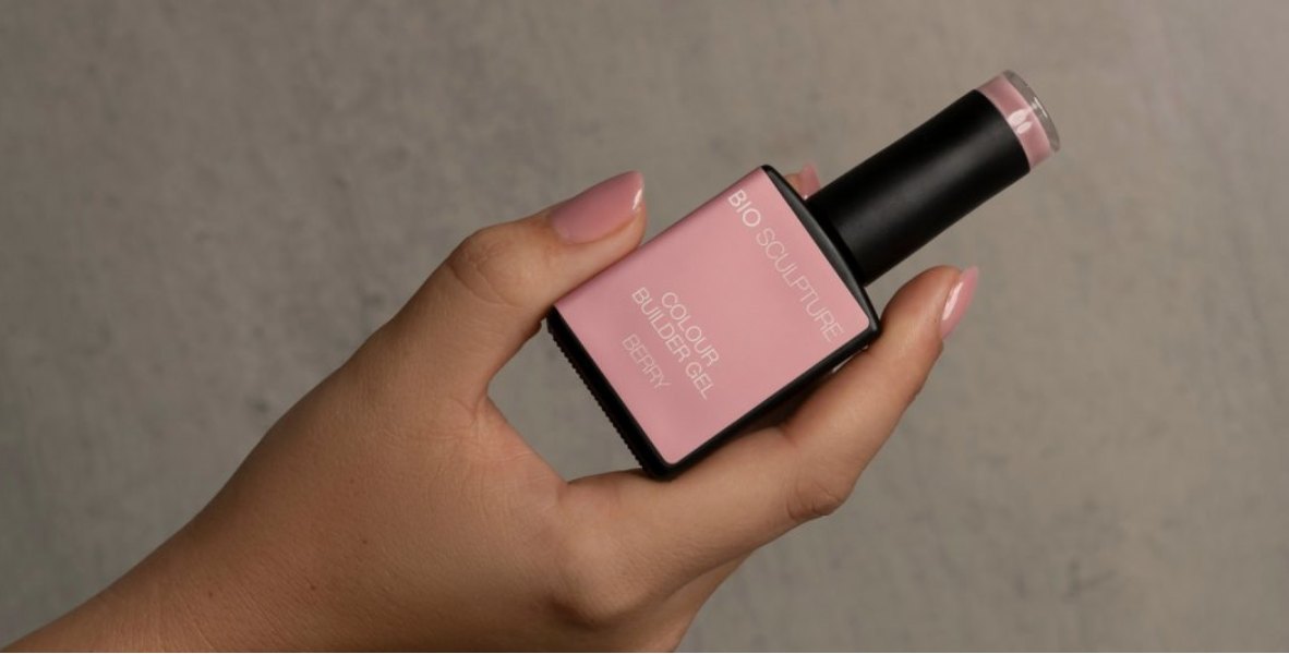 Bio Sculpture colour builder gel bottle held in a manicured hand
